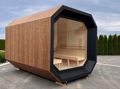 an outdoor sauna in the middle of a parking lot