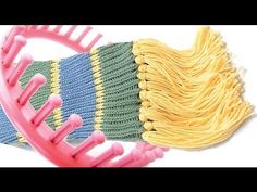 two combs are next to each other on a white surface with yellow and green hair