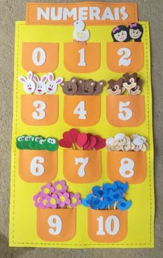 a bulletin board with numbers and animals in them on the floor for kids to use