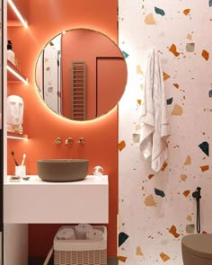 a bathroom with a sink, mirror and towel rack in the corner on the wall