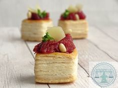 small pastries with fruit and nuts on them