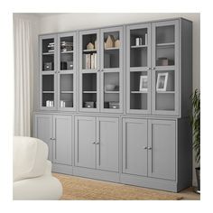 a large gray bookcase with glass doors