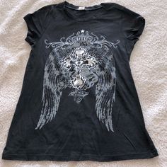 Nwot Lia Lee Rhinestone T-Shirt With Cross And Angel Wings Background. 100% Cotton. Non-Smoking Home. Y2k Emo Shirts, Angel Wings Background, Wings Background, Thrift Board, Grunge Tops, Affliction Shirts, 2000s Clothing, Rhinestone Shirt, Cross Shirt