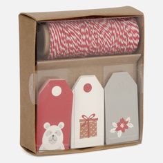 the box contains four different gift tags and two spools of red twine