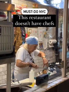 an old woman is making food in the kitchen with words above her that say, must do nyc this restaurant doesn't have chefs