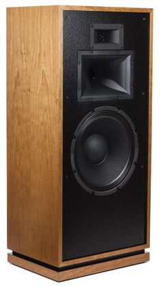 a large wooden speaker sitting on top of a table