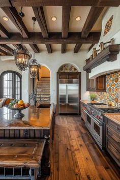 a large kitchen with wooden floors and an island