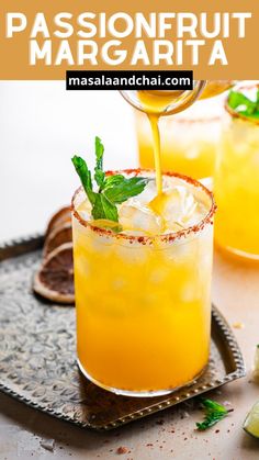 two glasses filled with lemonade and mint garnish on top of a tray