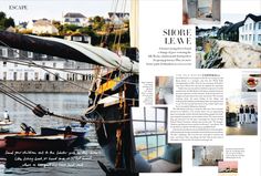 an article in a magazine with pictures of boats and buildings on the water behind it