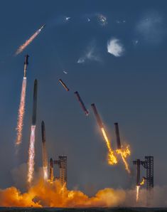 a group of rockets flying through the sky