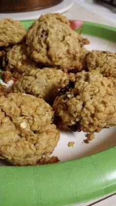 a green plate topped with cookies on top of a table