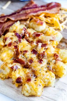 bacon and scrambled eggs on a cutting board