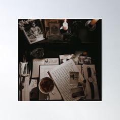 an overhead view of a desk with papers, pens and other things on it poster