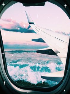 an airplane window with the view of the ocean and clouds from it's wing