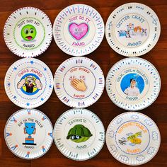 six paper plates with cartoon characters on them