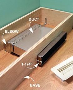 the bottom half of a drawer is shown with instructions to fit it in and out