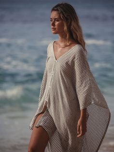 Make a memorable statement by the sea ​or in the lounge with the hand loomed Ava Kimono Black Stripes. An asymmetric frayed hem along with side slits, add movement and flow to a roomy drape. Featured artisanal striped motifs woven into its flowy fabric which boasts a linen-like feel. Breathable fibers and naturally built-in cooling properties make this the perfect beach kaftan. - V-neckline- Frayed & asymmetric hem- Side slits- Ultra-soft 100% Turkish cotton- One size fits most Beach Kaftan, Beach Kimono, Flowy Fabric, The Lounge, Pearl Jewellery Earrings, August Birth Stone, Independent Designers Fashion, By The Sea, Kimonos