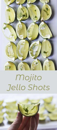 a person holding up a piece of fruit with the words mojito jello shots above it