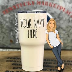 a woman standing next to a white cup with the words your name here on it