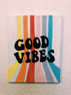 a painting with the words good vibes painted on it