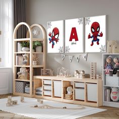 a child's room with two spiderman posters on the wall, and toys