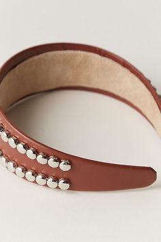 A unique addition to any collection of hair accessories, this headband features a wide silhouette and durable hard design with eye-catching embellishments and lined interior. | Showstopper Hard Headband by Free People in Brown Hard Headbands, Boho Clothing, Brown Leather, Embellishments, Free People, Hair Accessories, Top Brands, Great Deals, Luxury Fashion