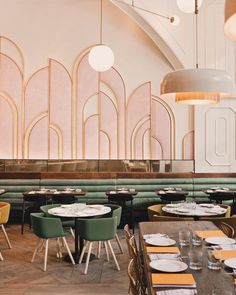 the interior of a restaurant with tables and chairs