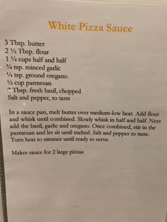 the menu for white pizza sauce is on display