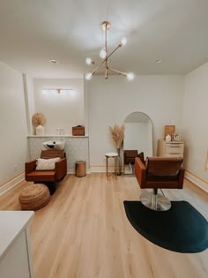 a living room filled with furniture and wooden floors