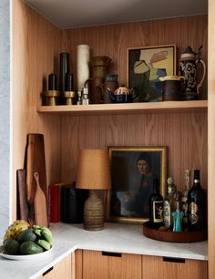 a shelf filled with lots of bottles and other items