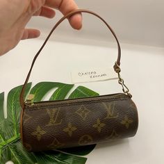 Louis Vuitton Mini Papillon Bag Barrel Monogram Logo Purse Y2K 2000's
Very good vintage condition. The canvas is perfect, hardware is tarnished. Interior has some pen marks on one side, no stickiness, etc.

1990-2000s pre-owned Papillon mini bag from Louis Vuitton Pre-Owned featuring brown, signature Monogram canvas, leather trim, cylindrical design, single top handle, top zip fastening, main compartment, gold-tone hardware and circa 1990-2000s. 

The most trending Louis Vuitton mini papillon. Can be hooked onto a larger LV bag to create a dramatic look. Can fit keys and credit cards. Seen on Ariana Grande. 

Roughly 6 x 2.25 x 2.25 
Strap drop: 5.5 inches 

Please Note: This model has no date code inside; it's the older style that came with the larger barrel papillon.

All of my items are Beach Handbag, 2000s Purse, Rolex Cartier, Gucci Nike, Older Style, Louis Vuitton Gucci, Big Bag, Older Fashion, Dramatic Look