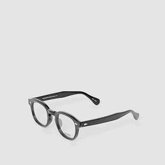 a pair of glasses sitting on top of a white surface