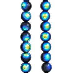 a long necklace with blue and yellow glass beads on a white back dropping background