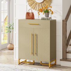 a beige cabinet with gold handles in a room