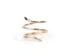 The Serpent Spiral Ring, available in fine quality 14 karat yellow gold filled or .925 sterling silver, is a captivating symbol of eternal transformation and wisdom. Handcrafted with sustainability at the core, each snake ring is meticulously hand forged from scratch by skilled local artisans. Featuring a 1/2" wide band with a 1mm thick wire, the ring boasts a unique snake texture that has been hand-hammered to perfection. The delicately handcrafted head of the snake flares out to 2mm, infusing Snake Texture, Patina Earrings, Raw Stone Necklace, Raw Stone Jewelry, Valentines Gift Guide, Raw Stone Ring, Spiral Ring, Bold Necklace, Simple Stud Earrings