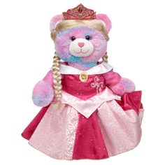 a pink teddy bear wearing a princess dress