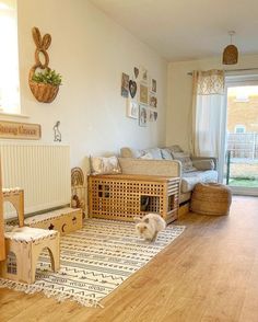 a living room filled with furniture and a cat