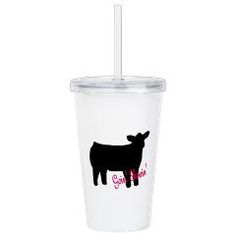 a plastic cup with a straw in the shape of a cow on it's side