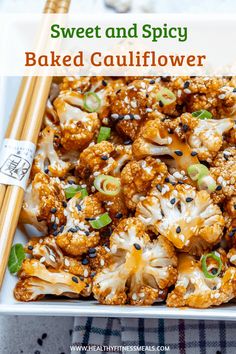 sweet and spicy baked cauliflower with sesame seeds in a white square dish, with chopsticks on the side