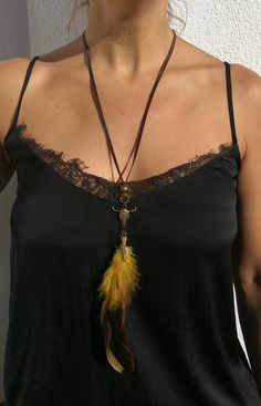 Feather Long Necklace, Boho Jewelry, Bohemian Jewelry, Head Skull Necklace, Feather Choker, Hippie Necklace, necklace for women, Bronze Necklace. Unique and original feather long necklace reproduced in limited quantity, so you could be sure you will wear an exclusive necklace. It is perfect to show off in day or night time, and on any occasion ( business, party, beach, dinner...) This boho jewelry piece is made of high quality genuine cow leather, two feathers, a head skull metal pendant and bea Bohemian Lariat Choker For Festivals, Adjustable Bohemian Necklaces With Feathers, Adjustable Feather Necklace As Gift, Bohemian Feather Jewelry Gift, Yellow Bohemian Choker Necklace, Bohemian Yellow Choker Necklace, Adjustable Feather Festival Jewelry, Adjustable Feather Jewelry For Festivals, Feather Necklace Diy