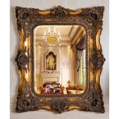 an ornate gold framed mirror in a living room