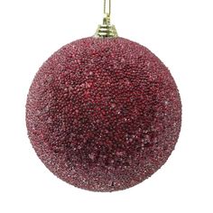 a red ball ornament hanging from a gold chain on a white background with room for text