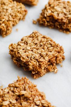 granola cookies are arranged on a sheet of parchment paper