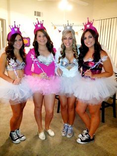 three women dressed in costumes posing for the camera with one woman wearing a tiara