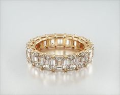 14K Yellow Gold Emerald Cut Diamond Eternity Ring (7 CTW H-I / SI1-SI2). This timeless eternity ring features the boldness and elegant gleam of emerald cut diamonds. A classic, tailored shared prongs setting allows the maximum amount of the diamonds surface to show. Number of diamonds and carat total weight will vary depending on ring size. Emerald Eternity Ring, Ring Upgrade, Eternity Ring Gold, Diamond Eternity Ring, Jewelry Photoshoot, Gold Diamond Wedding Band, Emerald Engagement Ring Cut, Emerald Cut Diamond, Eternity Ring Diamond