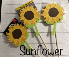 two sunflowers are sitting on top of each other with the words gift card in front of them