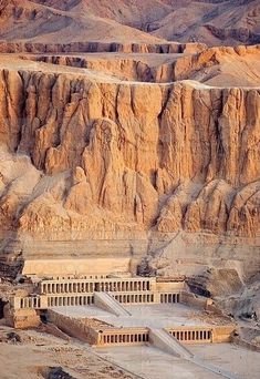 an aerial view of the ancient city of philaeon in egypt, with mountains in the background