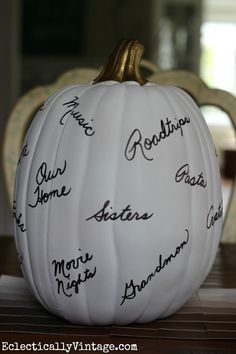 a white pumpkin with writing on it