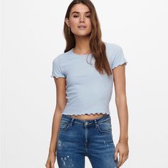 Elodie Pointelle Knit Lettuce Trim Cap Sleeve Tee In Blue, Size M, Nwt *1st Pic Shows A Similar Style Of Wear. *Bundle & Save! Thank You So Much For Checking Out My Closet! I Love To Offer Great Deals And Will Always Take Offers Or Counter My Very Lowest Due To Pm Fees! I Ship Quick And Strive To Make Your Process Seamless! Please Note I Do Not Offer Measurements On Items And Those Questions Will Be Respectfully Left Unanswered. Have A Wonderful Day! Bnaa4 3-165 Light Blue Ribbed Knit Top, Trendy Light Blue Knit Tops, White Sheer Top, Maroon Blouse, Cap Sleeve Tee, Light Blue Shorts, Pointelle Knit, Floral Print Shirt, Stretch Top