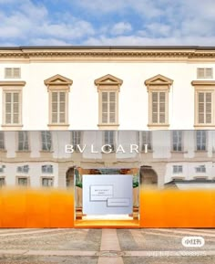 an open door in front of a building with windows and doors on each side that say bvl gari